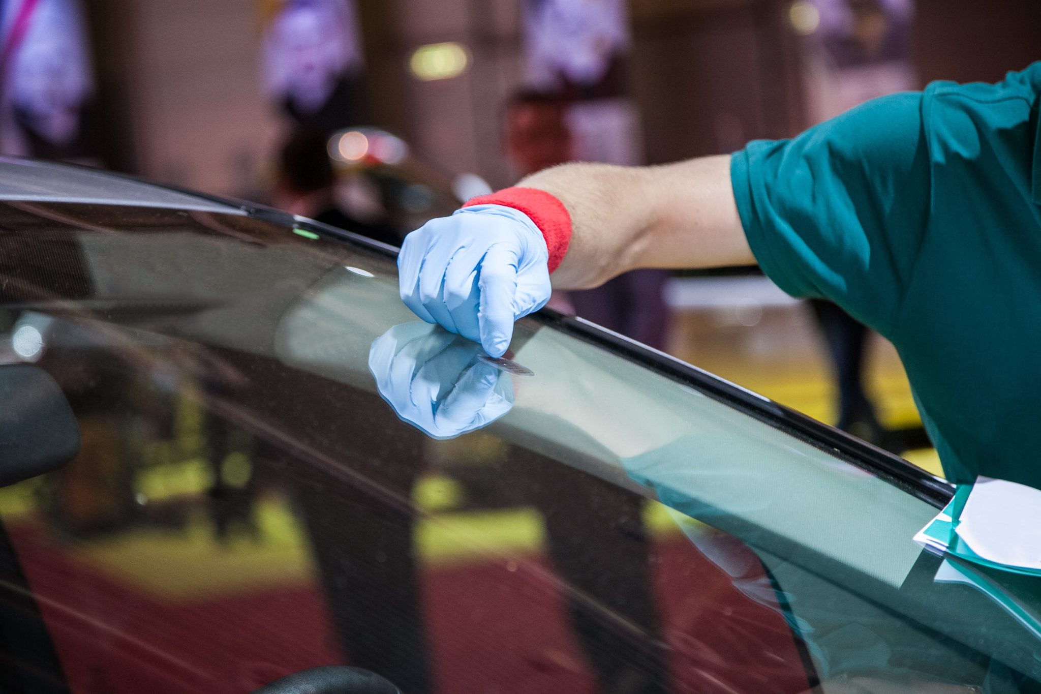 Dodge Challenger windshield replacement in Phoenix, Arizona - repair equipment positioned on a vehicle windshield